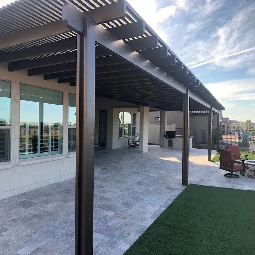 Pergola with custom rafter tails and evenly spaced shade slats in Cedar Park.
