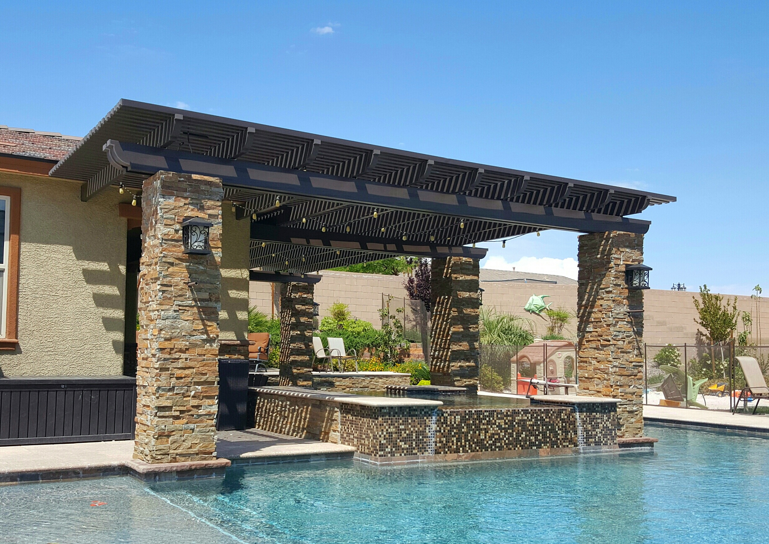Patio cover in San Antonio, TX with ceiling fans and lights