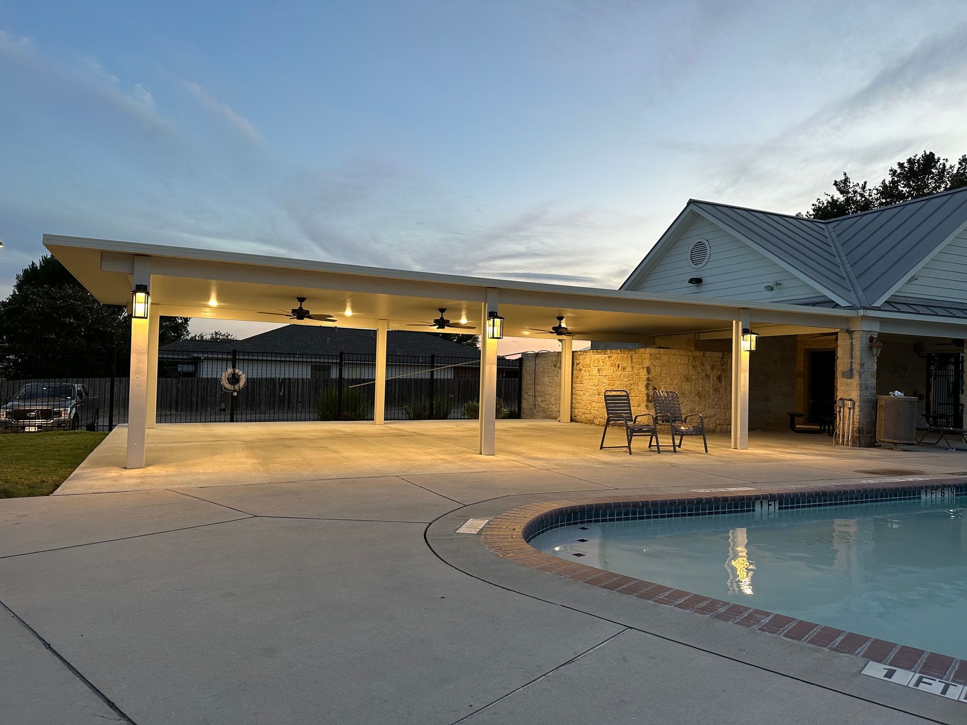Outdoor patio cover with ceiling fan installation in Round Rock, TX