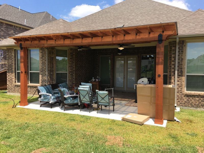 Pergola built over an outdoor kitchen for added comfort and shade in Tarrytown.