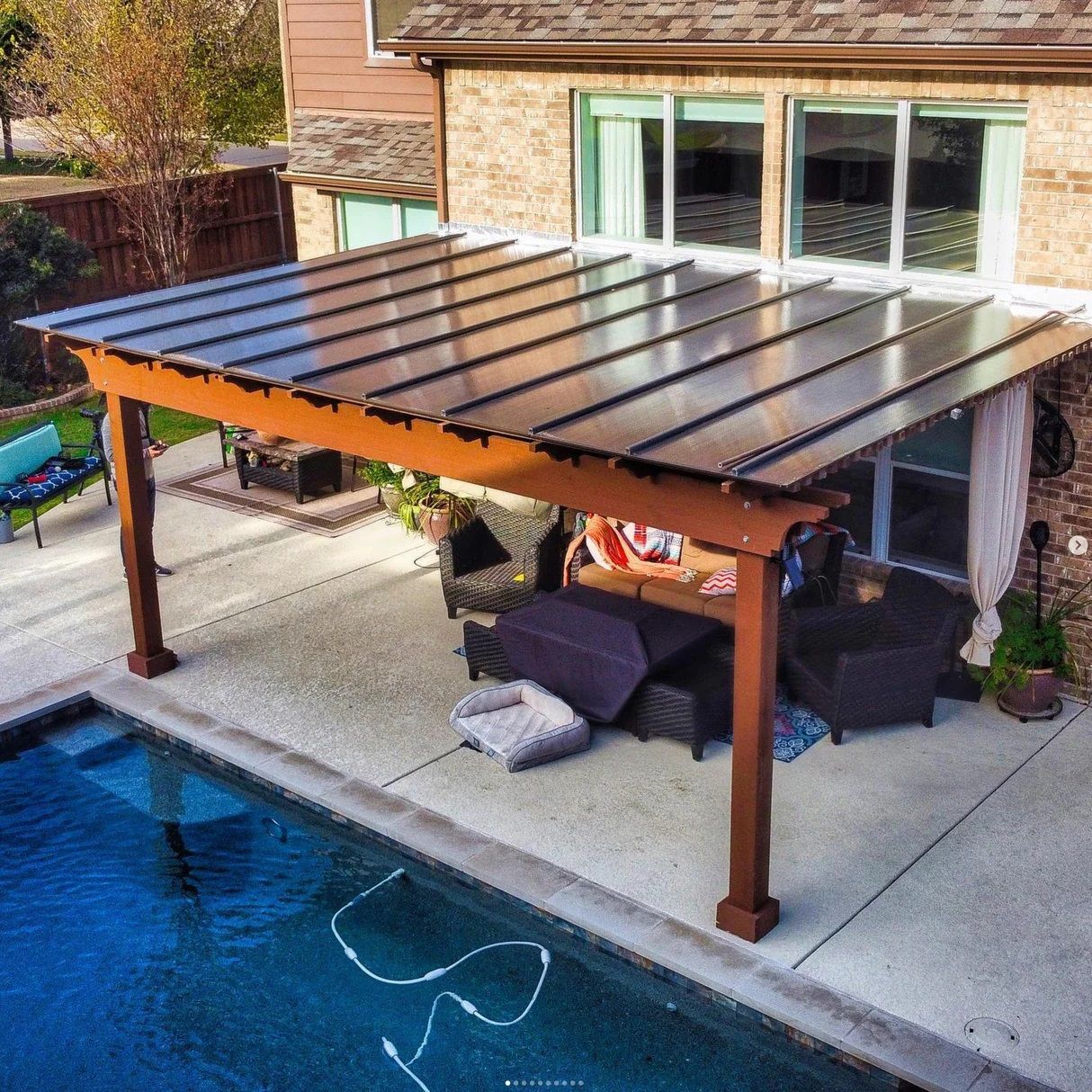 Cedar pergola with stained finish and reinforced posts in Steiner Ranch.