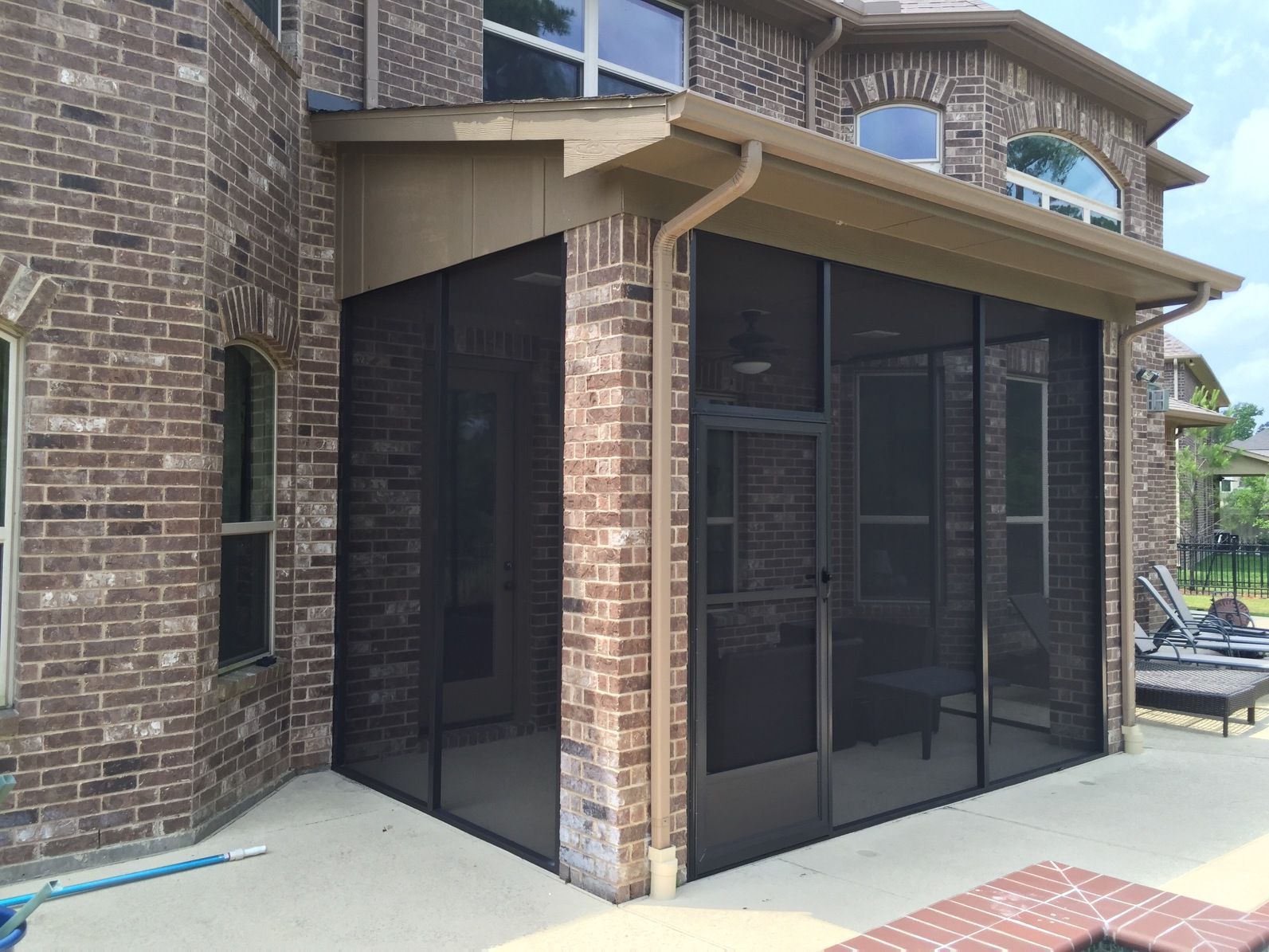 Cedar Park screen room with an insulated roof and ceiling fan support, perfect for year‑round outdoor lounging.