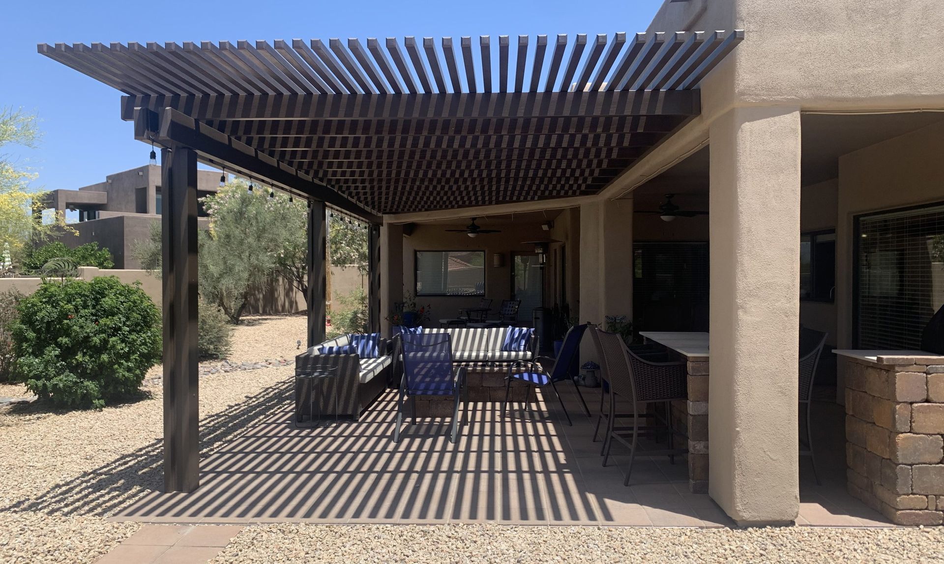 Pergola offering partial shade and architectural style in Lakeway, TX.