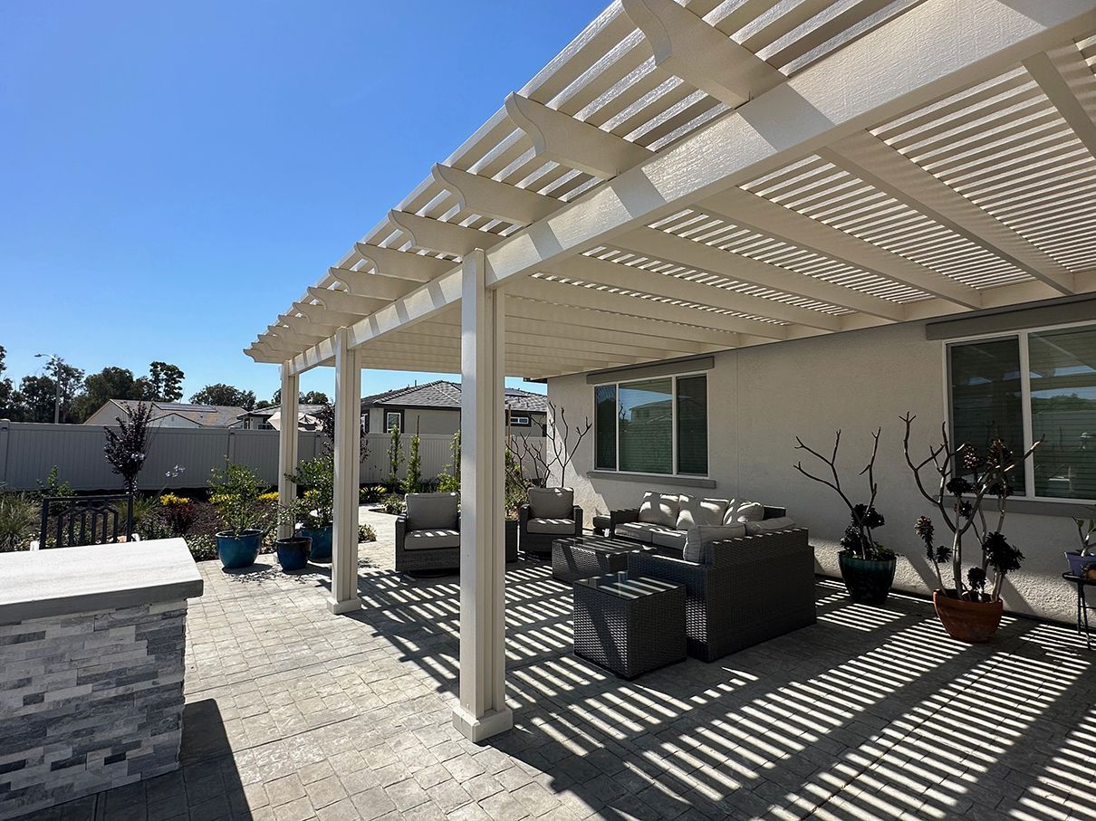 A pergola extending shade coverage across a backyard patio in Austin, TX.