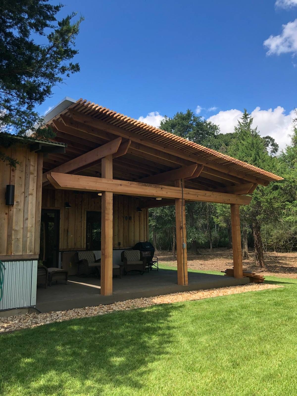 Outdoor living patio cover with stone accents in Fredericksburg, TX