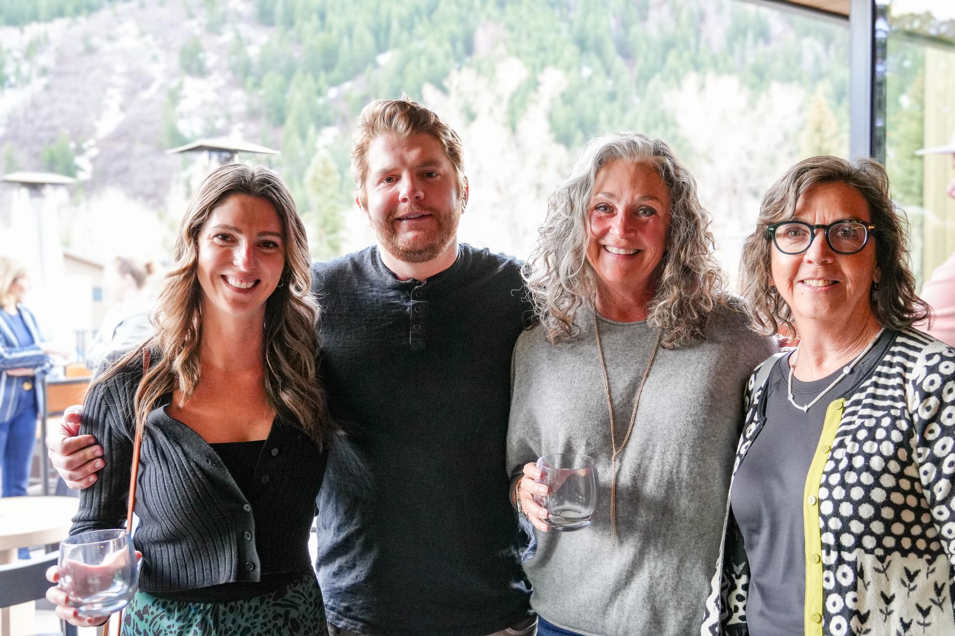 Attendees enjoying a CORE-sponsored community sustainability event, surrounded by interactive exhibits and solar-powered demonstrations in Aspen.