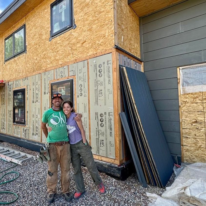 CORE energy expert speaking with a local homeowner in Eagle County about building efficiency improvements and rebate opportunities.