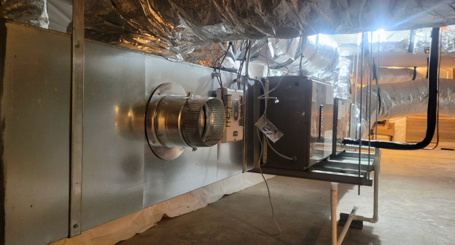CORE staff member conducting a home energy assessment in Aspen, demonstrating their hands-on approach to climate solutions.