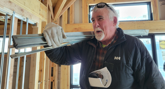 CORE staff member conducting a home energy assessment in Aspen, demonstrating their hands-on approach to climate solutions.