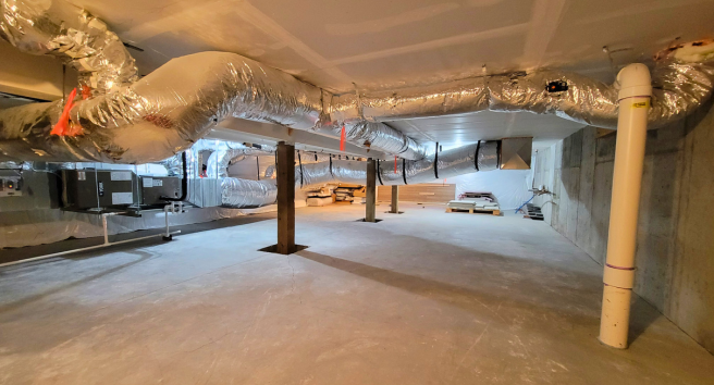 CORE staff member conducting a home energy assessment in Aspen, demonstrating their hands-on approach to climate solutions.