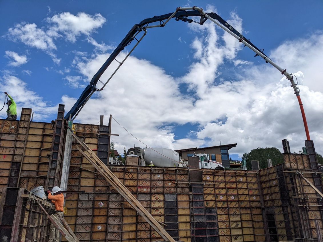 concrete boom truck pumping into concrete forms