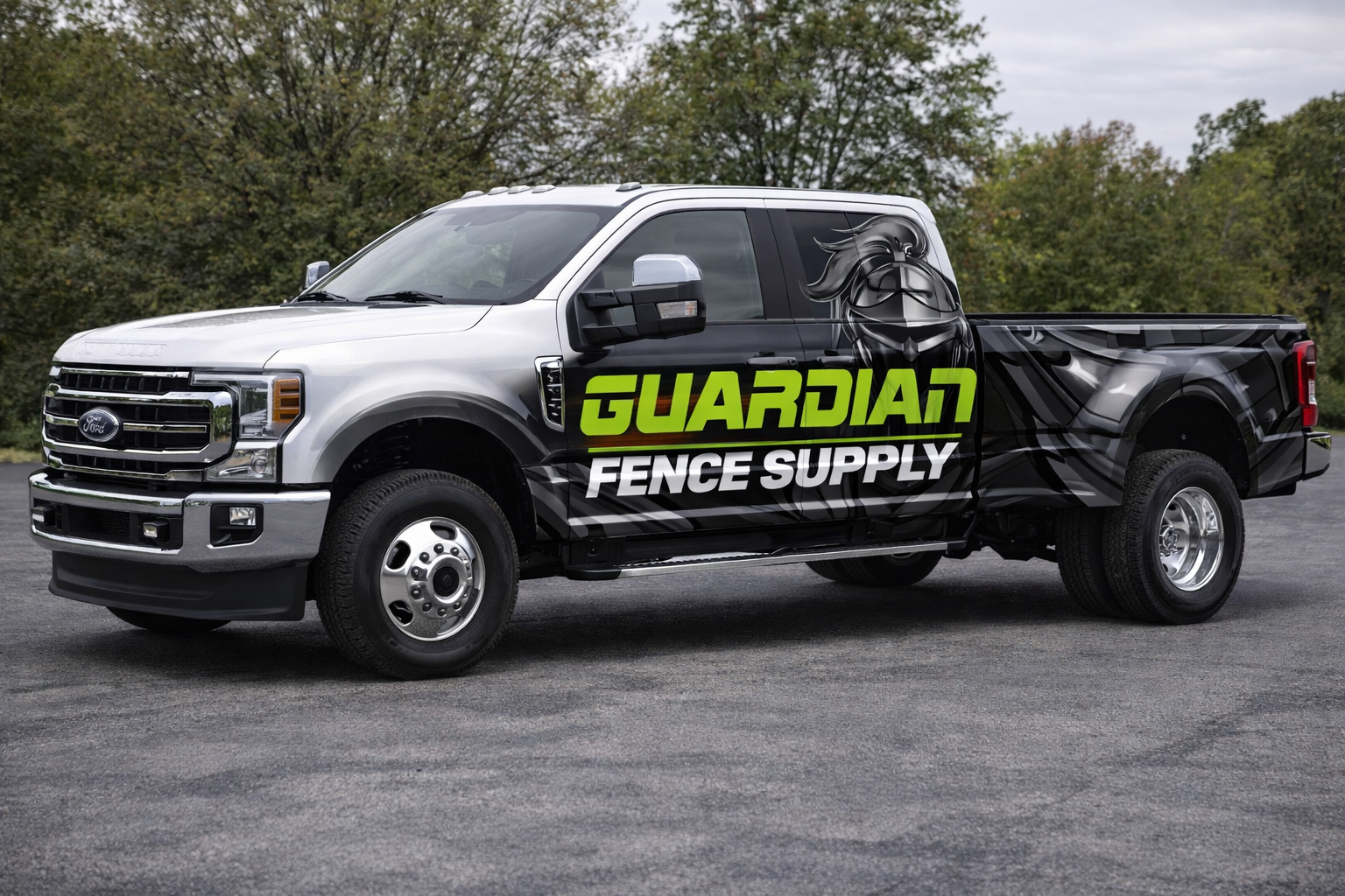 A white roofing company truck is parked in a grassy field.