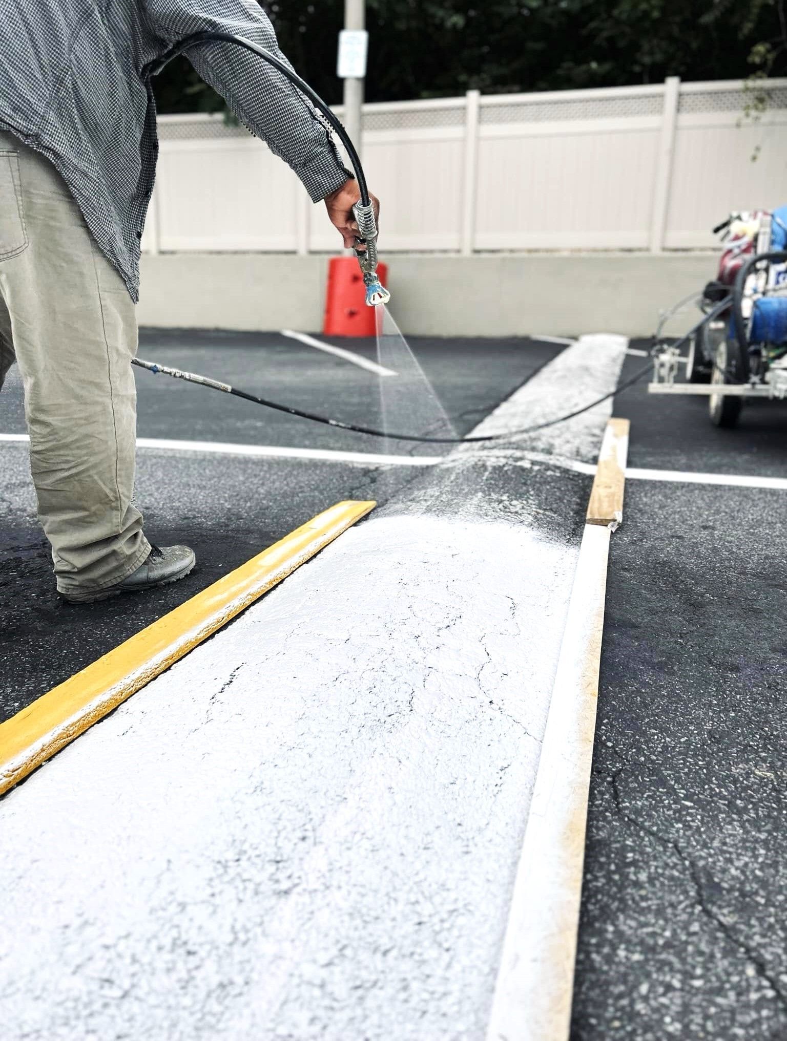 Image of a guy installing a speed bump.