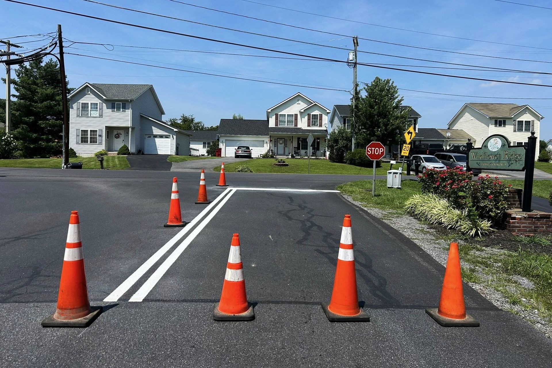 Image of a street that is getting lines painted.