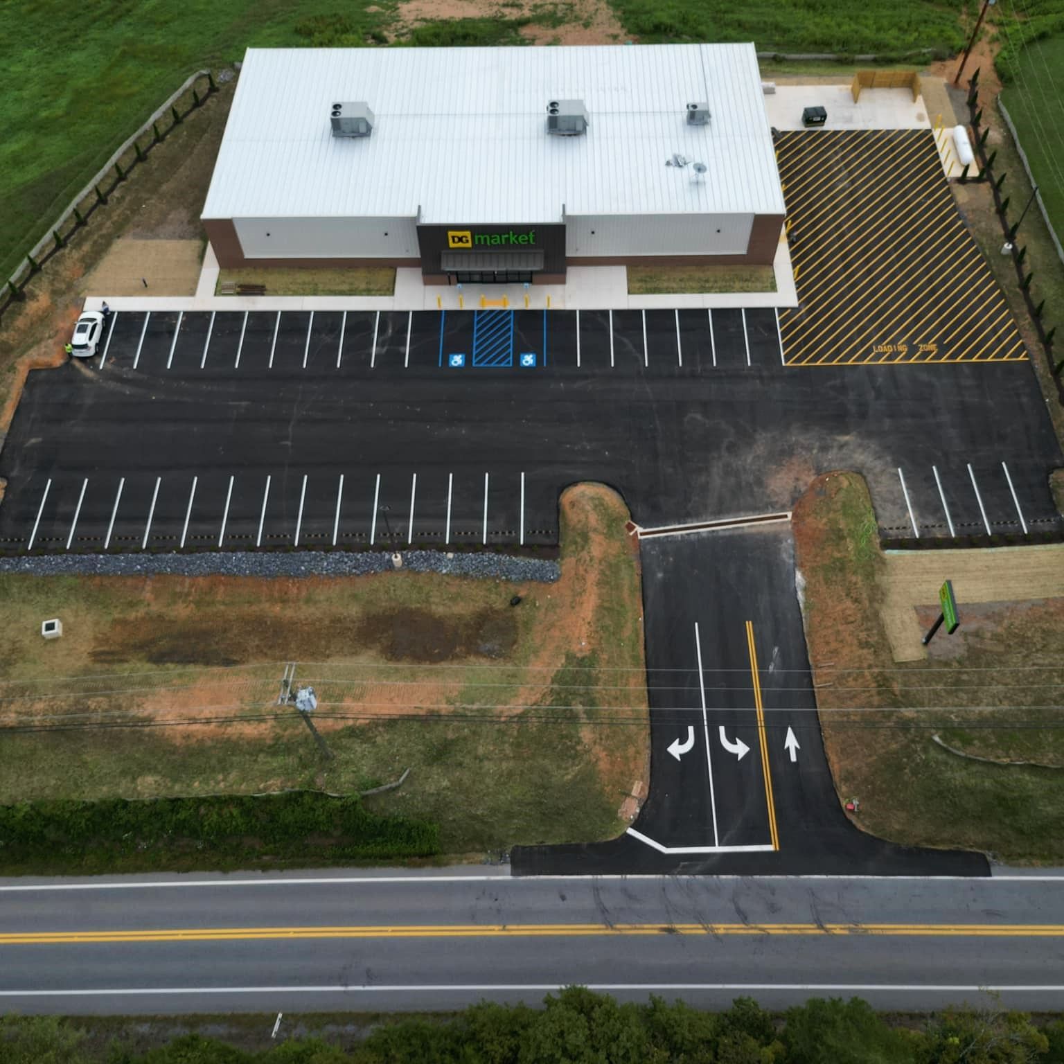 Image of a parking lot that has the parking spaces clearly painted.