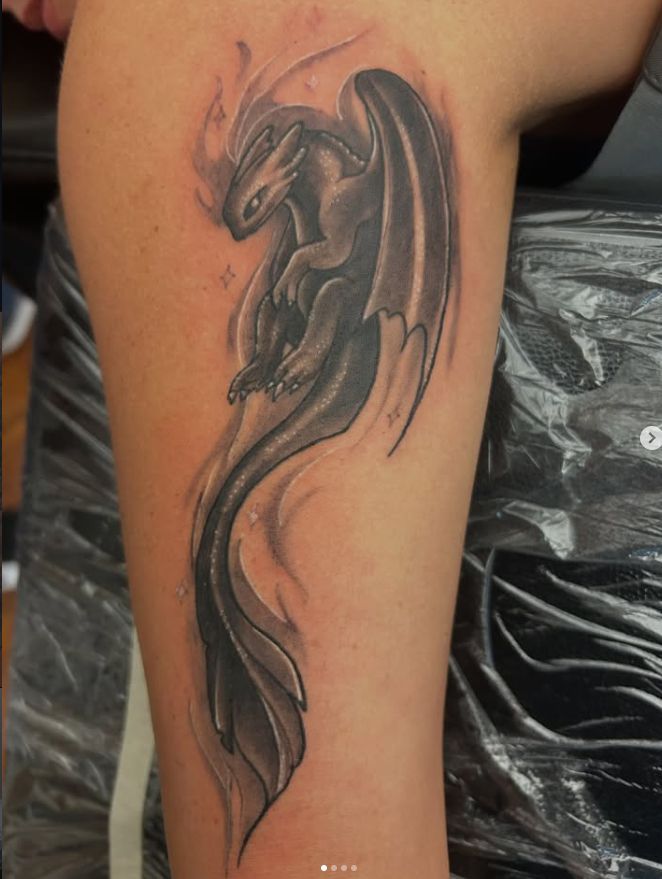 Tattoo by Tom Kelly at The Widow's Son Tattoo Co. in Gilbertsville, PA — a black and grey dragon down a leg