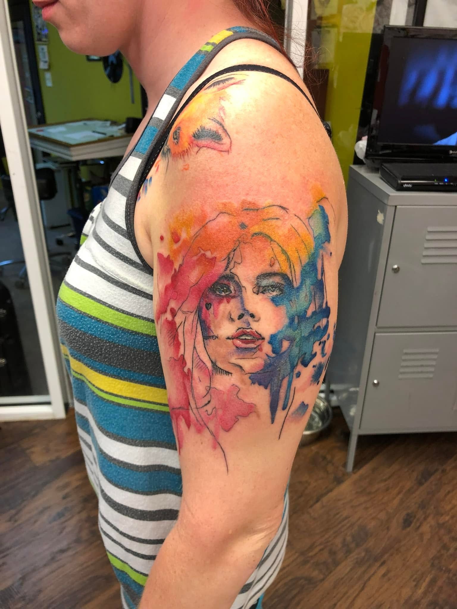 Tattoo by Eric Estrada at The Widow's Son Tattoo Co. in Gilbertsville, PA — a watercolour-style portrait on an upper arm