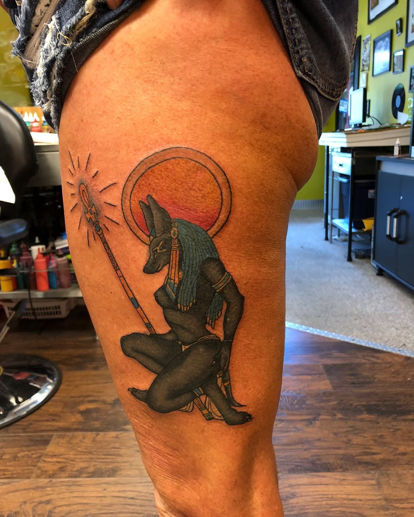 Tattoo by Eric Estrada at The Widow's Son Tattoo Co. in Gilbertsville, PA — a colour Egyptian figure on a thigh