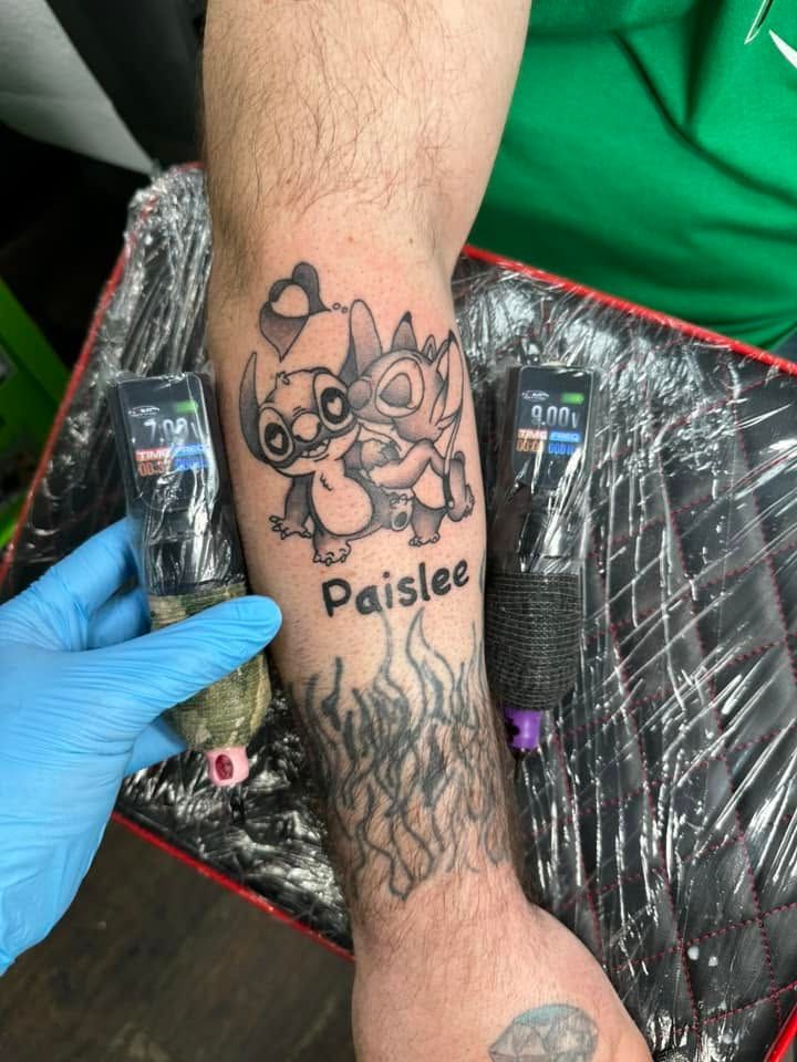 Tattoo by Eric Estrada at The Widow's Son Tattoo Co. in Gilbertsville, PA — a small colour character piece with a child’s name on a leg