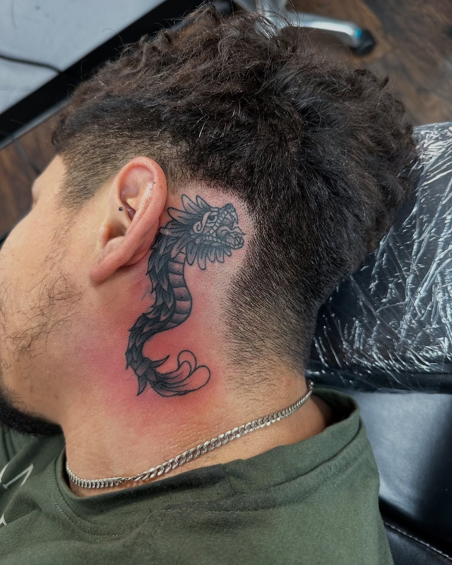 Tattoo by Eric Estrada at The Widow's Son Tattoo Co. in Gilbertsville, PA — a black and grey neck piece, closer in