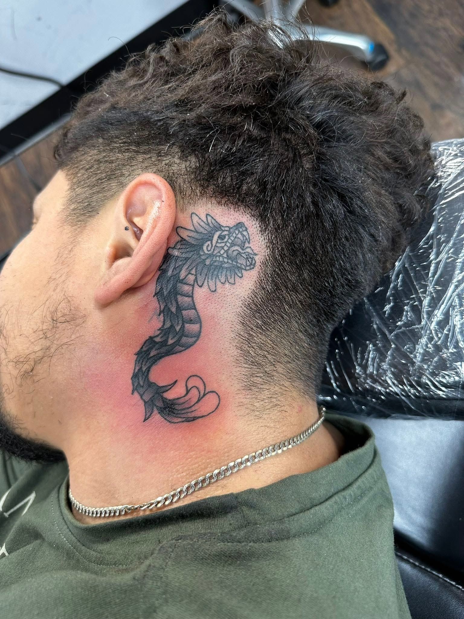 Tattoo by Eric Estrada at The Widow's Son Tattoo Co. in Gilbertsville, PA — a black and grey smoke piece running from behind the ear down the neck