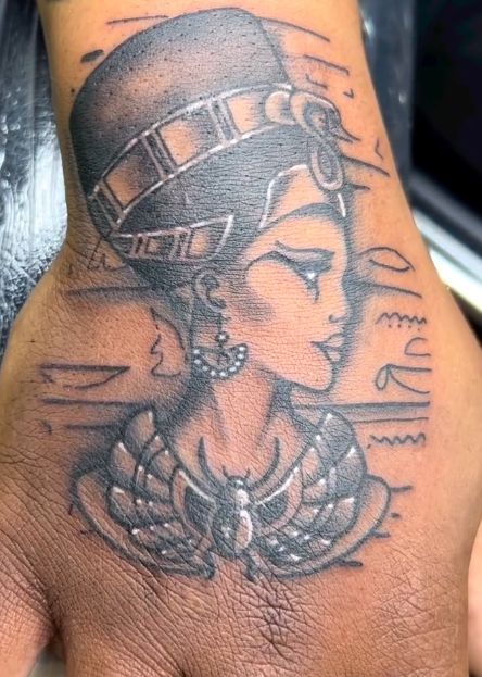 Tattoo by Tom Kelly at The Widow's Son Tattoo Co. in Gilbertsville, PA — a black and grey Egyptian queen with a scarab