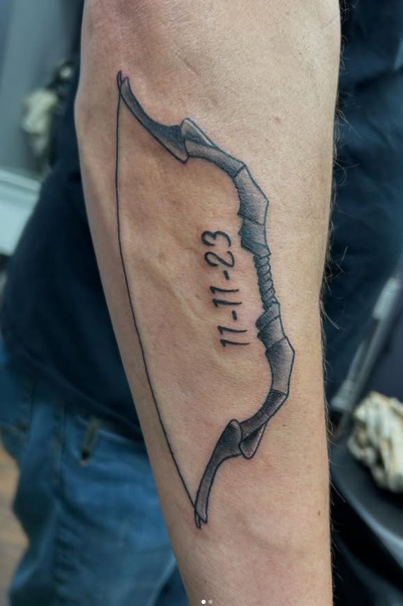 Tattoo by Tom Kelly at The Widow's Son Tattoo Co. in Gilbertsville, PA — a date in fine script on a forearm