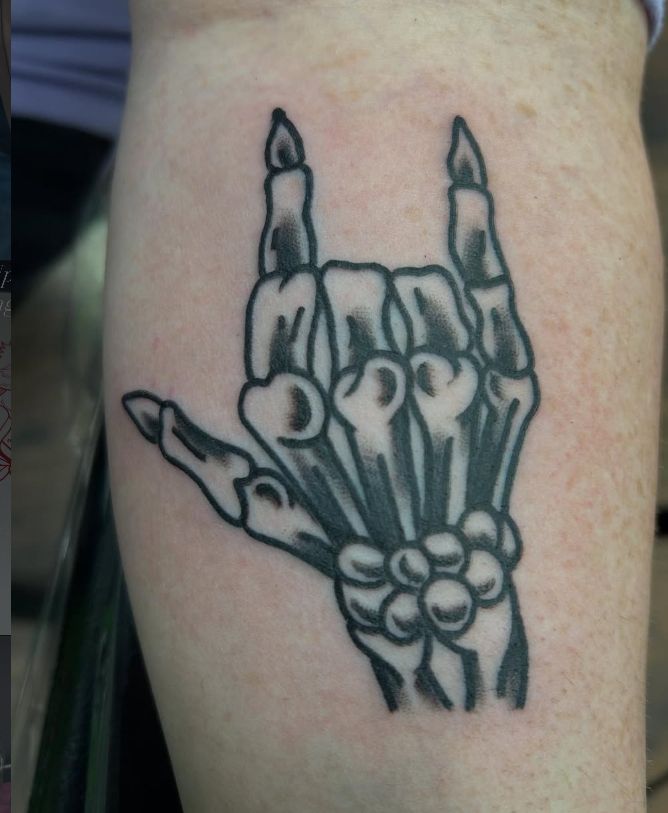 Tattoo by Tom Kelly at The Widow's Son Tattoo Co. in Gilbertsville, PA — a black and grey skeleton hand