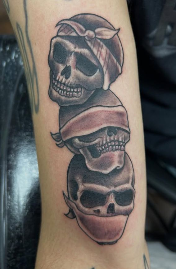 Tattoo by Tom Kelly at The Widow's Son Tattoo Co. in Gilbertsville, PA — a black and grey skull in a helmet