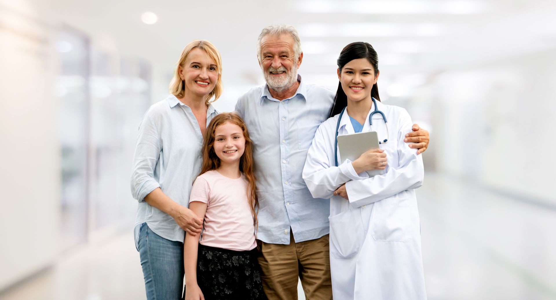 Doctor with a happy family at a hospital. Doctor with a happy family at a hospital.