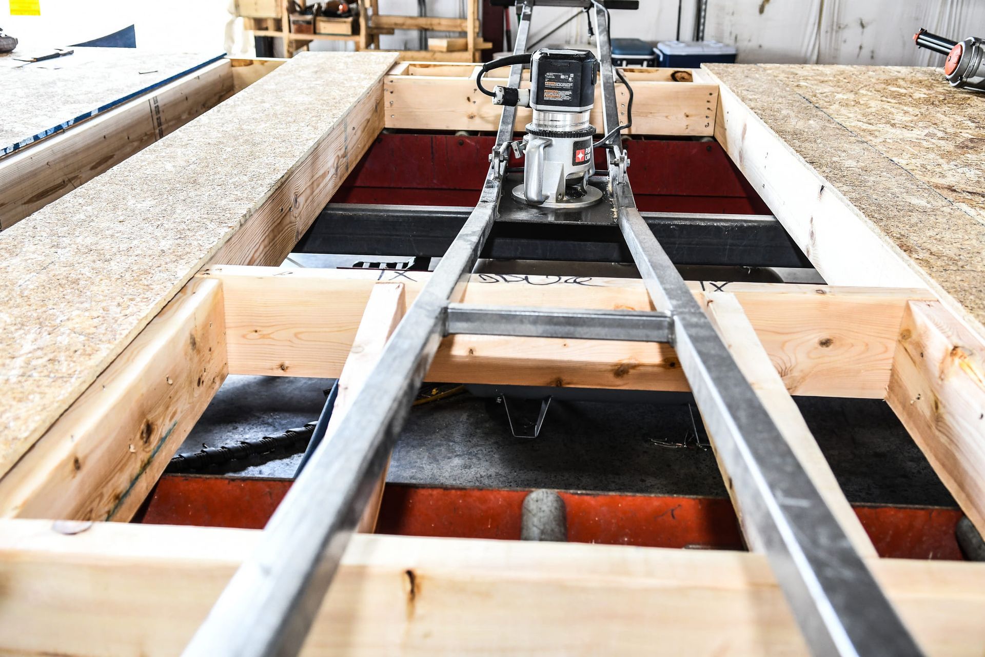 A machine is sitting on top of a wooden structure.