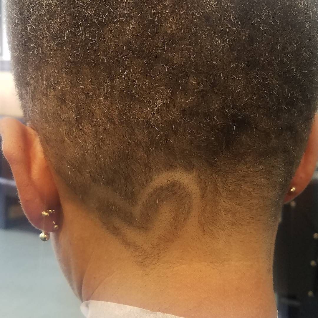 Back of head with a heart-shaped hair design shaved into the nape