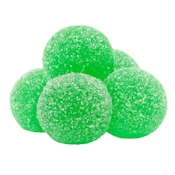 Green sugar-coated gummy candies stacked in a small pyramid