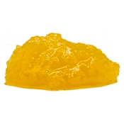 A yellow crystalline rock or mineral on a white background