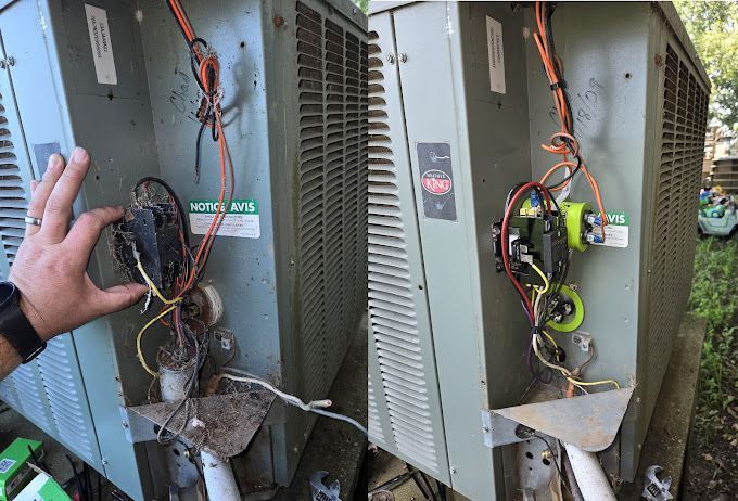 A person is holding a piece of electrical equipment in their hand.