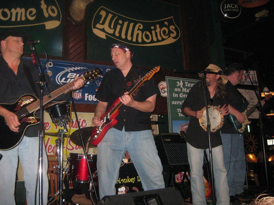 A band performs live at a bar called 