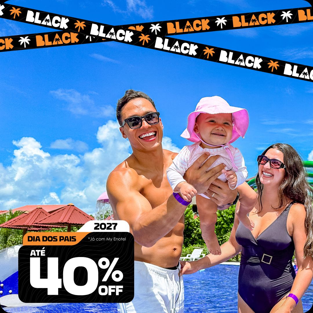 Casal sorrindo e brindando com drinks coloridos enquanto relaxam em espreguiçadeiras à beira da piscina do resort Enotel. A imagem exibe o selo da promoção My Black com até 40% de desconto para reservas em dezembro de 2027.