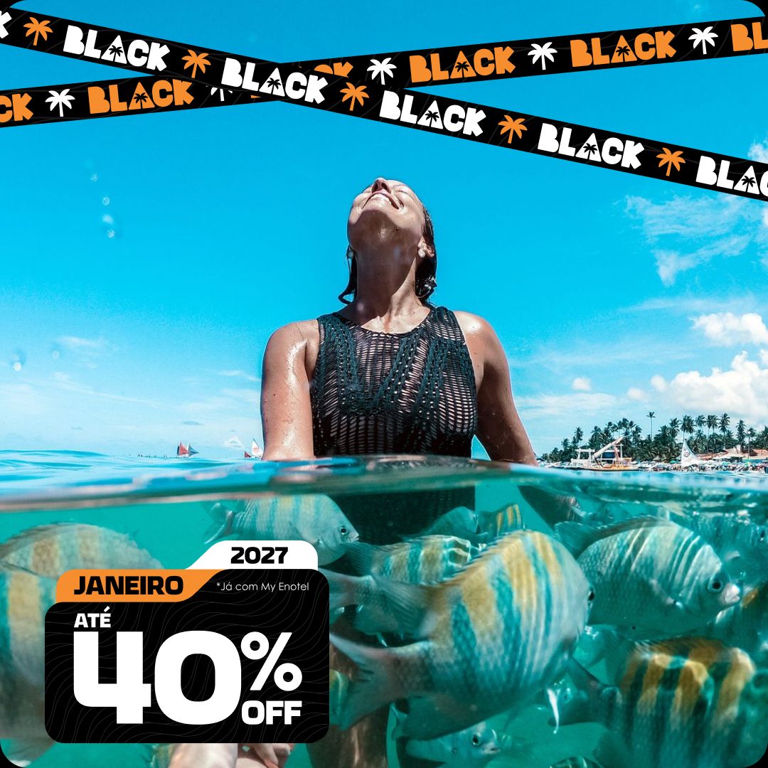Mulher sorridente no mar de Porto de Galinhas, cercada por peixes sargentinhos sob a água cristalina, em um dia ensolarado no resort Enotel. A imagem contém faixas de Black Friday no topo e um selo promocional destacando as ofertas para Janeiro de 2027 com até 40% de desconto.