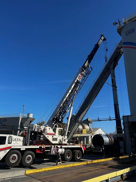 A large crane is sitting on top of a truck.