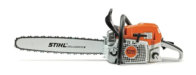 A stihl chainsaw is sitting on a white surface.