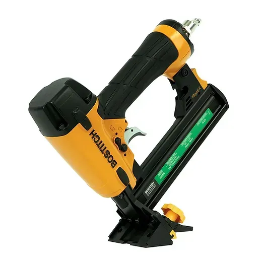 A black and yellow bostitch stapler on a white background