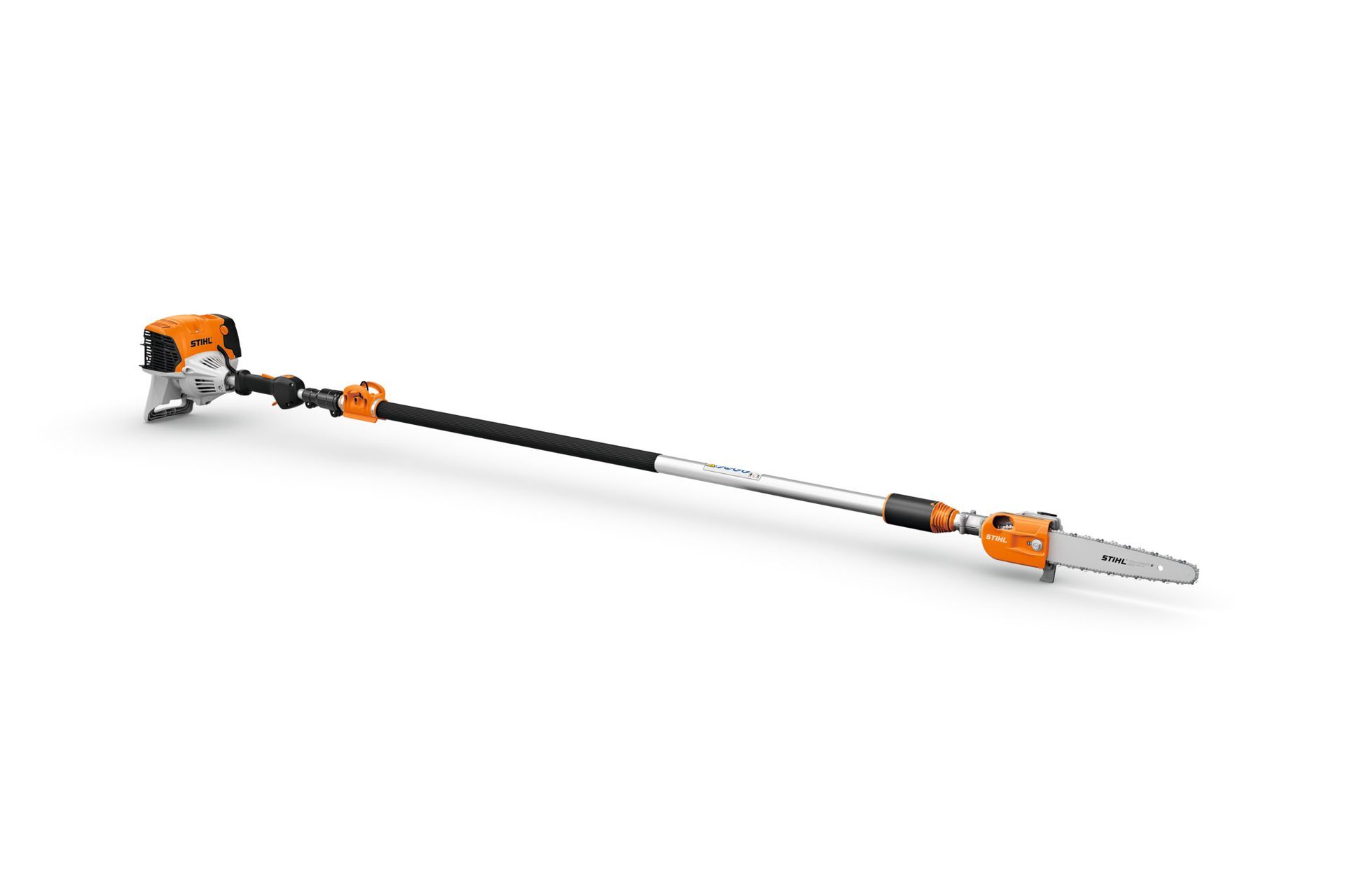 A stihl pole saw is sitting on a white surface.