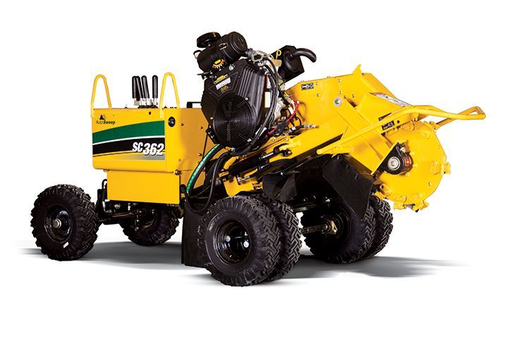 A yellow stump grinder is sitting on a white surface.