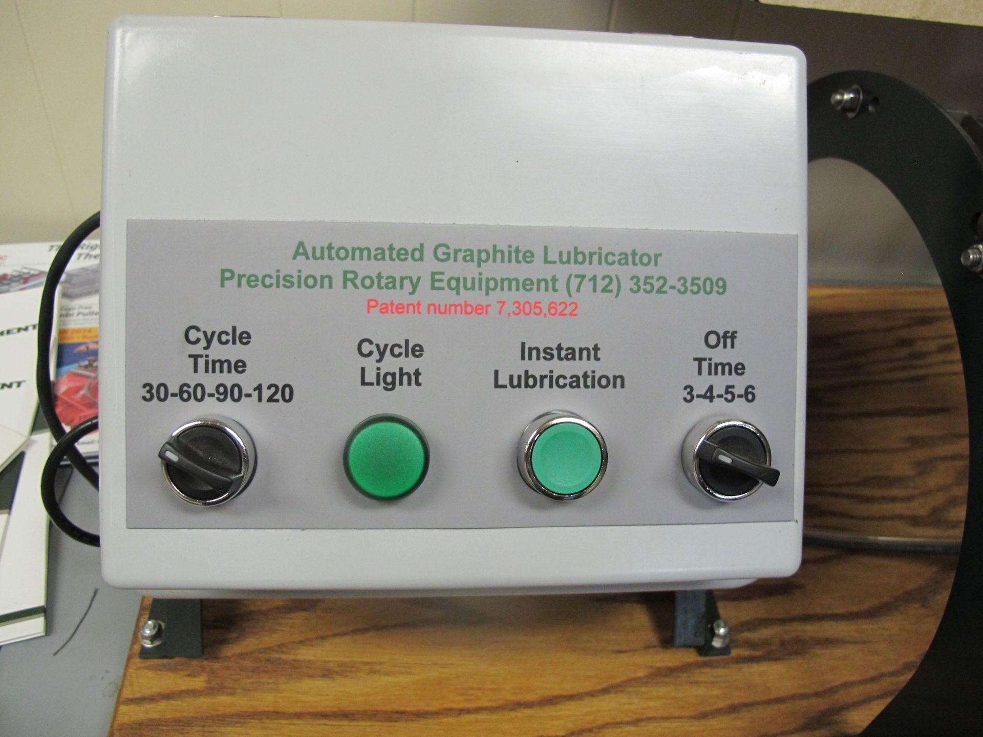A box that says automated graphite lubricator on it