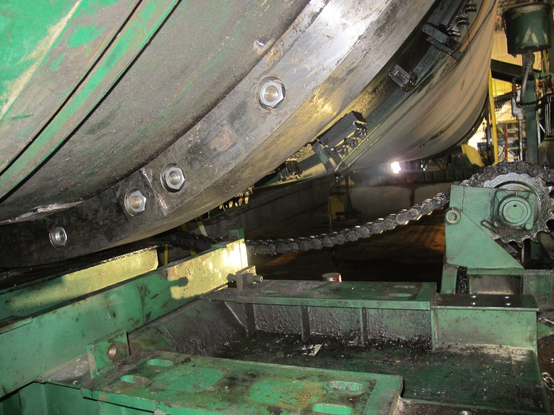 A large machine is sitting on top of a green platform