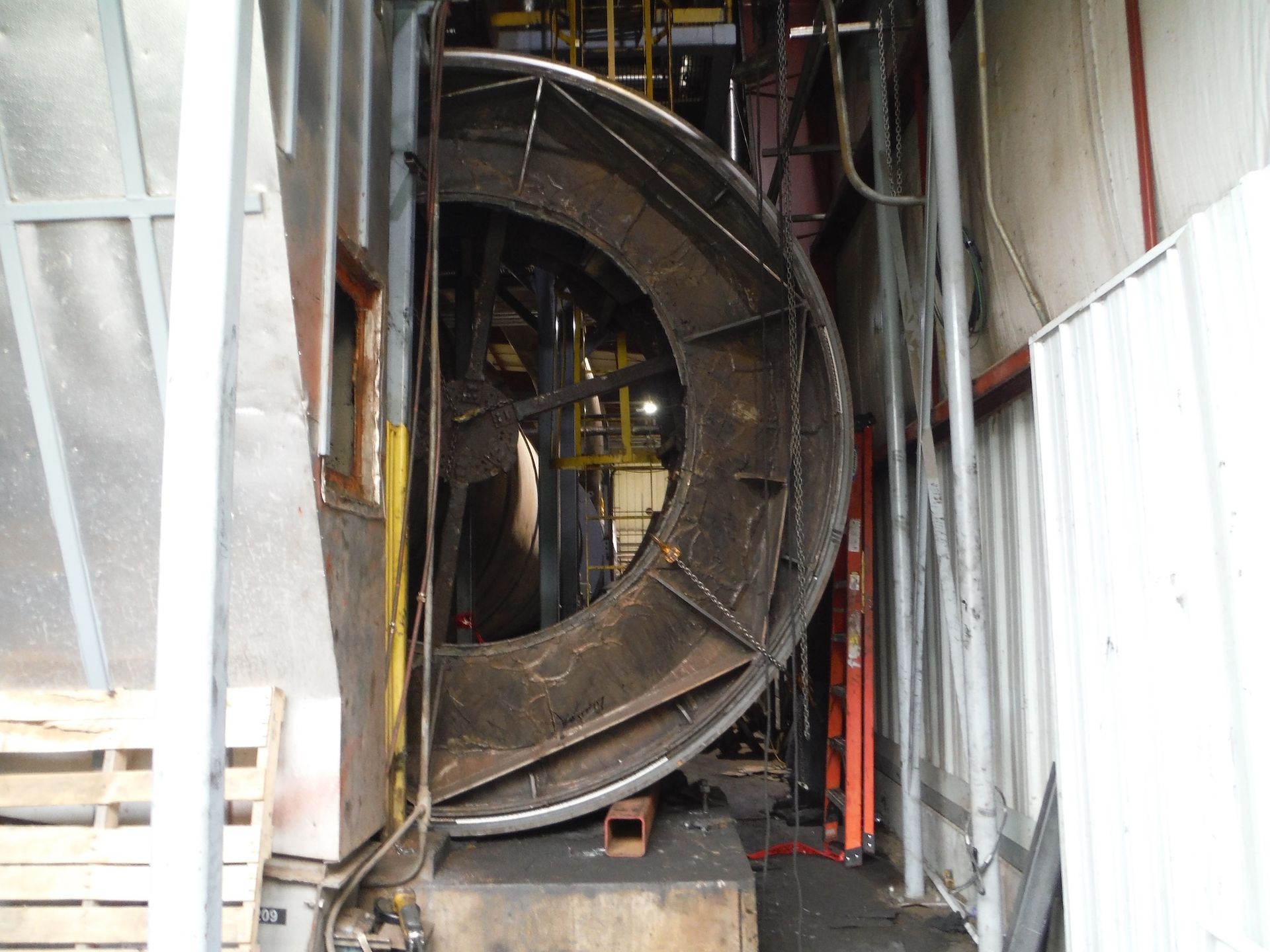 A large metal object is sitting inside of a building