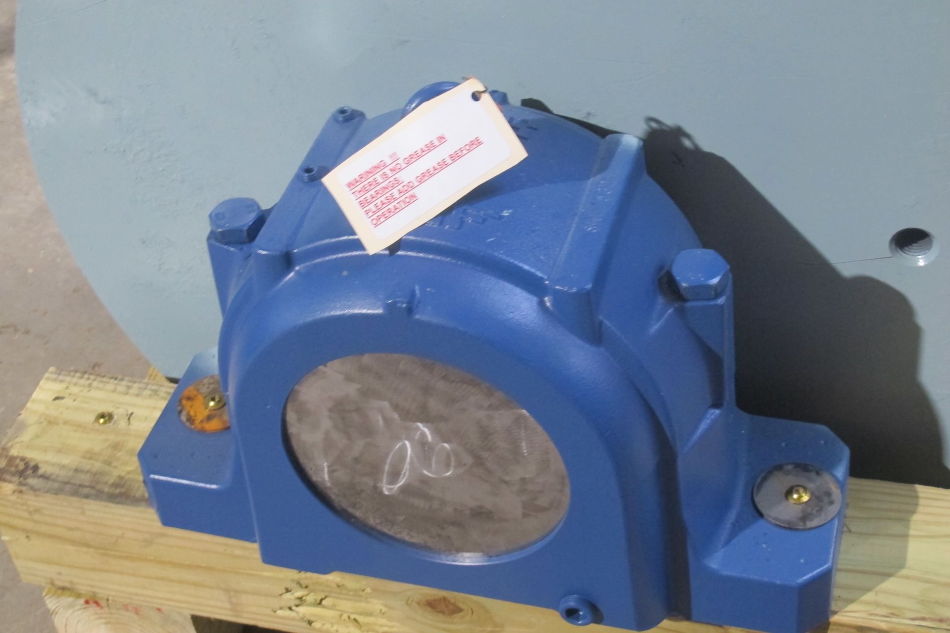 A blue object with a tag on it that says ' a ' on it