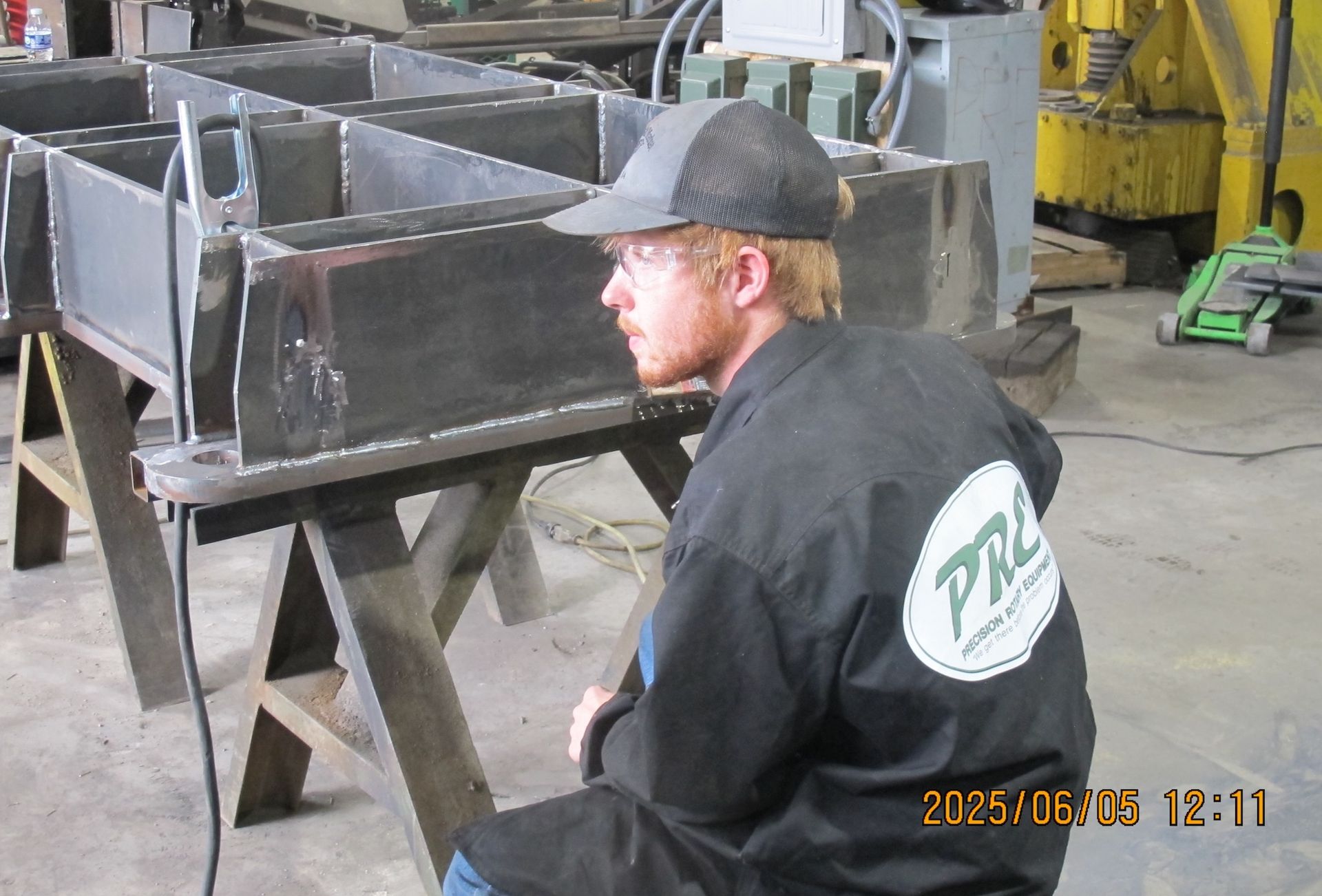 A man wearing a black jacket with the word pro on the back