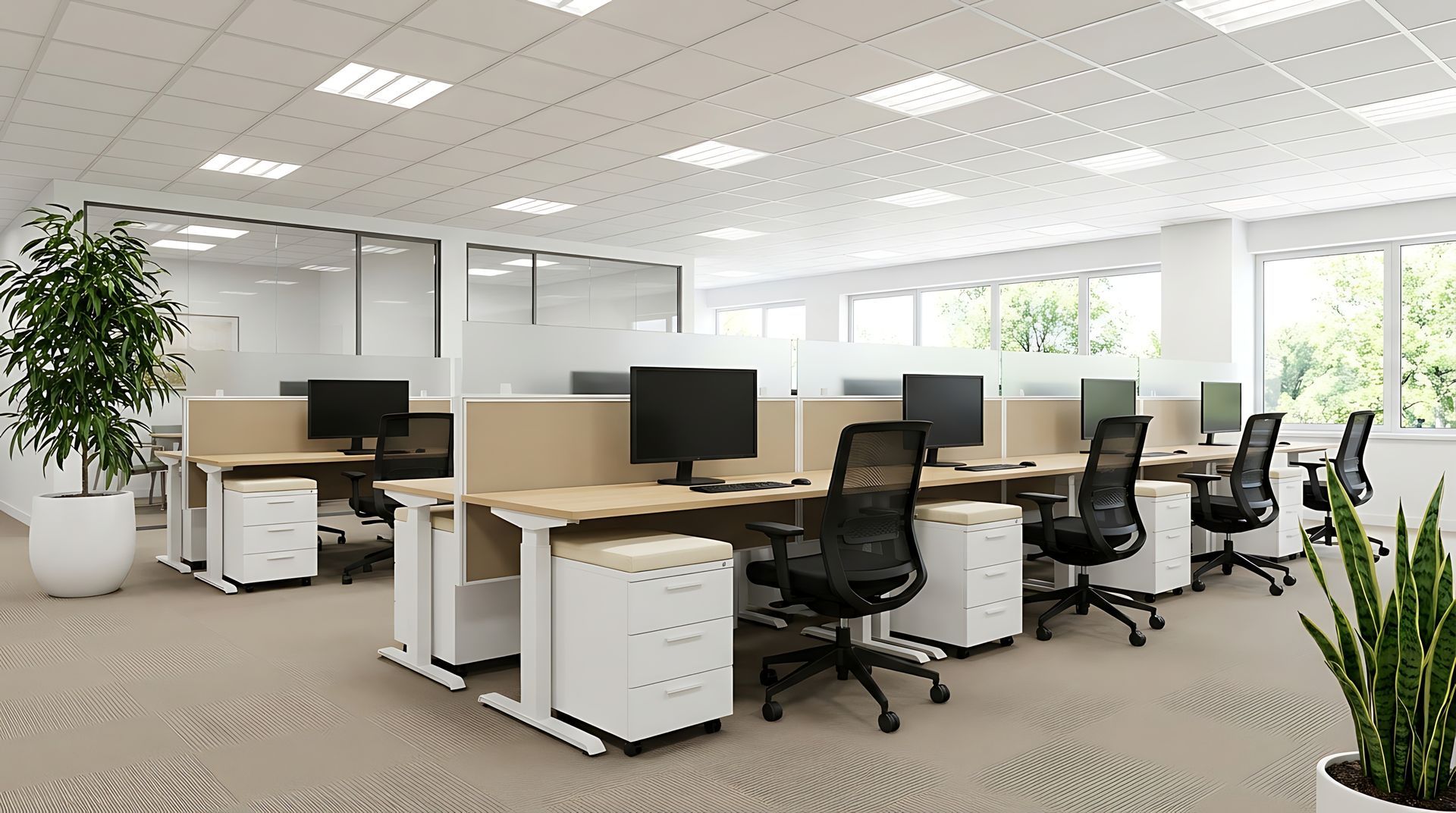 office workspace featuring a black desk with a computer monitor Bright open office with rows of desks, computer monitors, black chairs, and large windows in the background