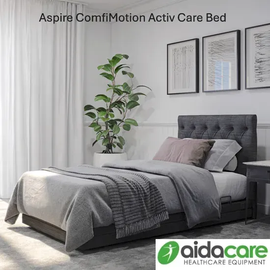 Modern grey adjustable care bed in a bright bedroom with plant and framed wall art